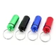 Porte-clés capsule (ici en plusieurs couleurs)